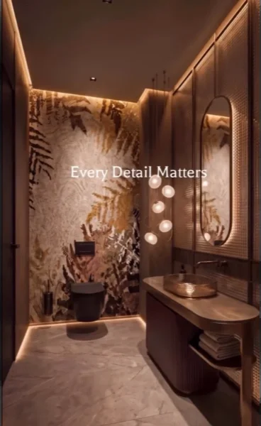 Dark powder room with a botanical tile feature wall, backlit oval mirror, vessel sink and hidden LED lighting