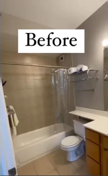 Tub and shower combo with a curtain rod, beige tile surround and wood vanity